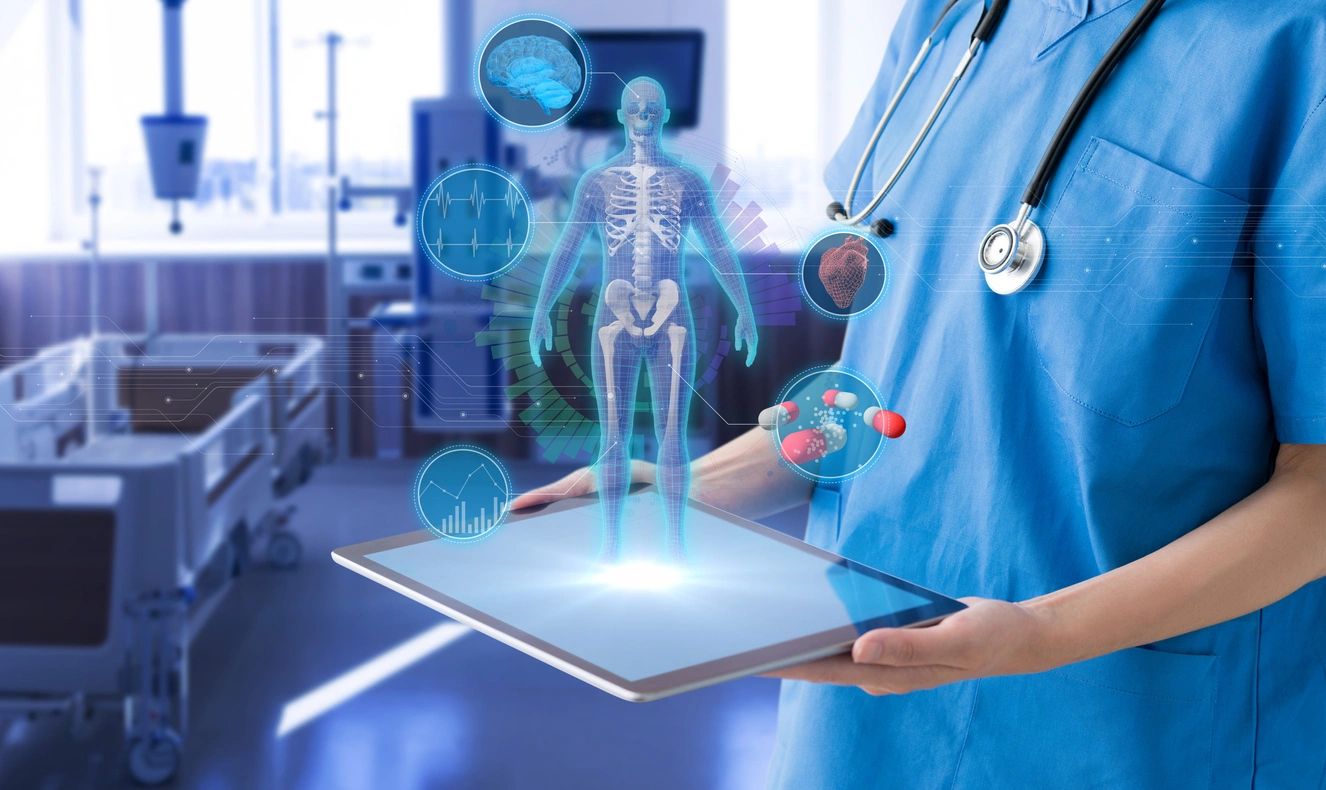 A doctor holding a tablet in his hand.